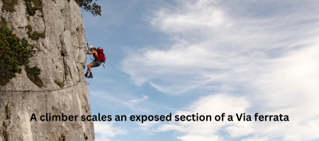 A climber scales an exposed section of a Via ferrata.